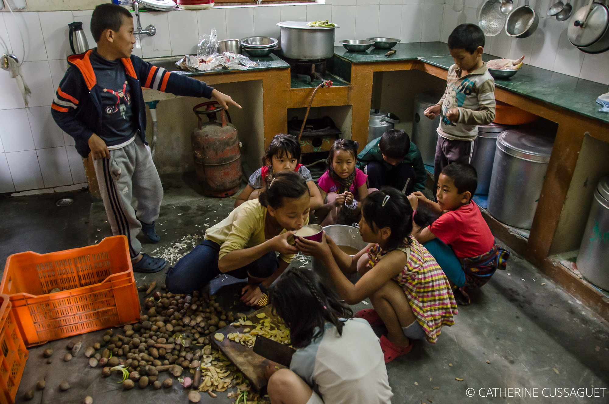 Children peeling potatoes