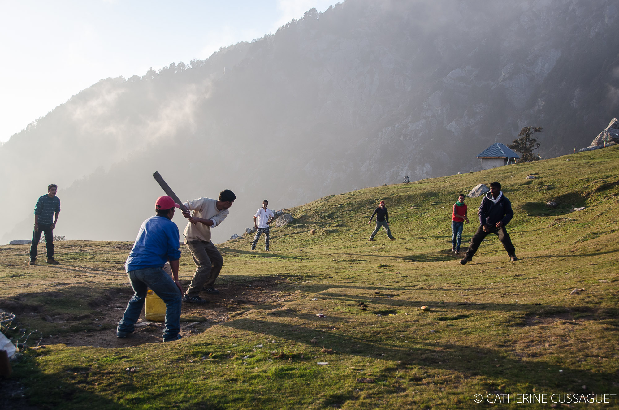 men playing cricket