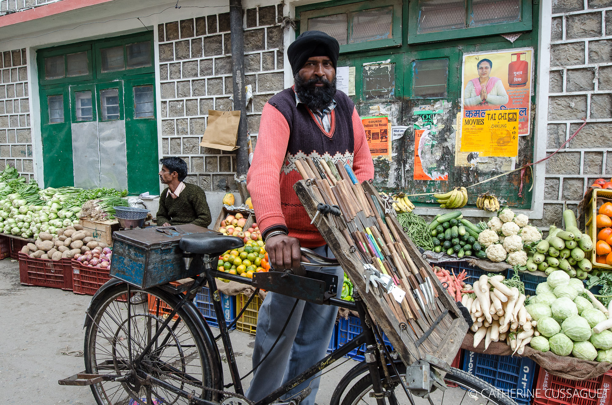 Man, bicycle, knives