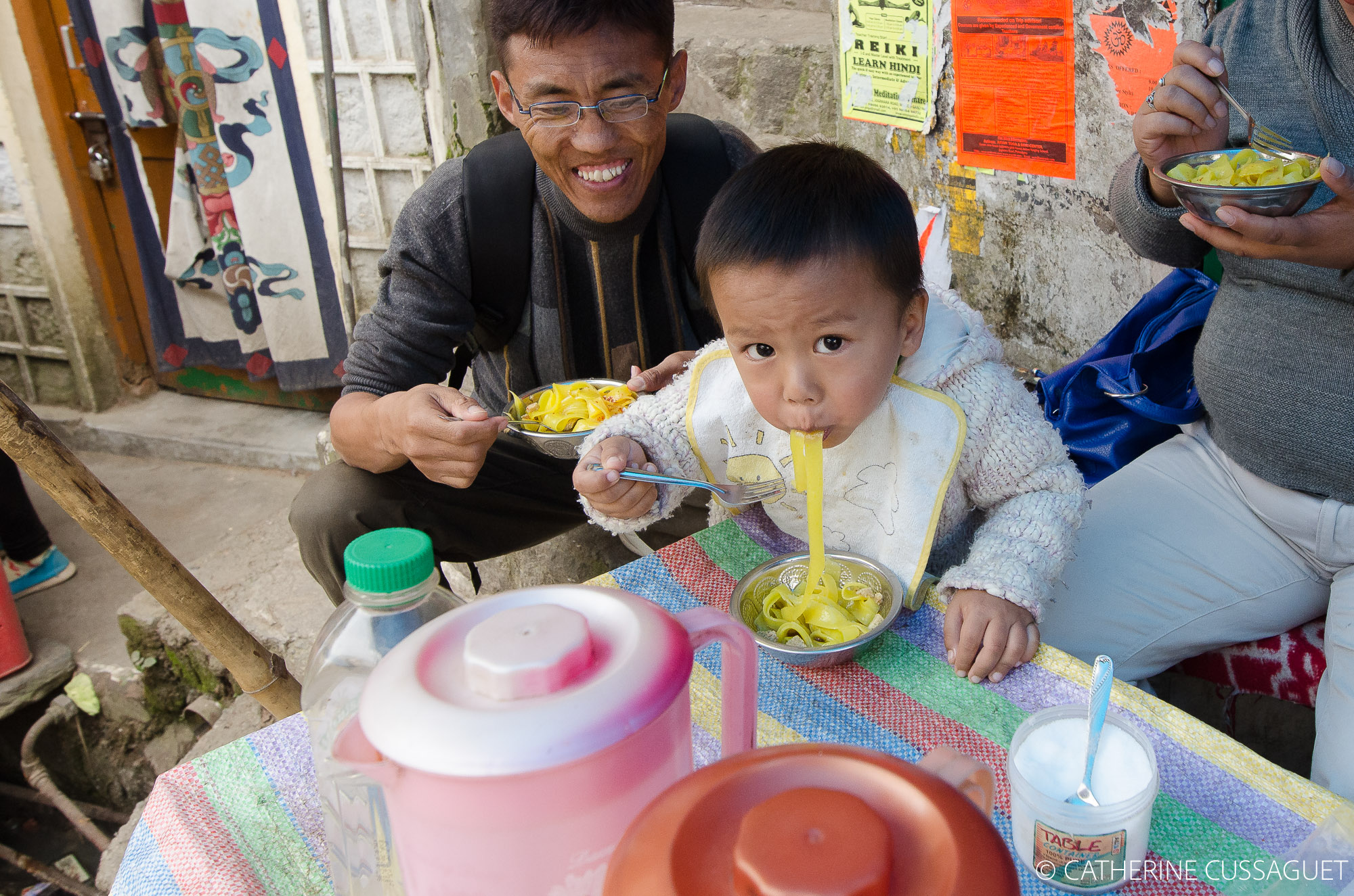 kid eating noodles