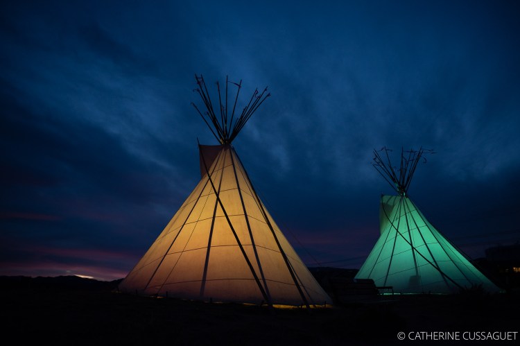 yellow and green lit teepees